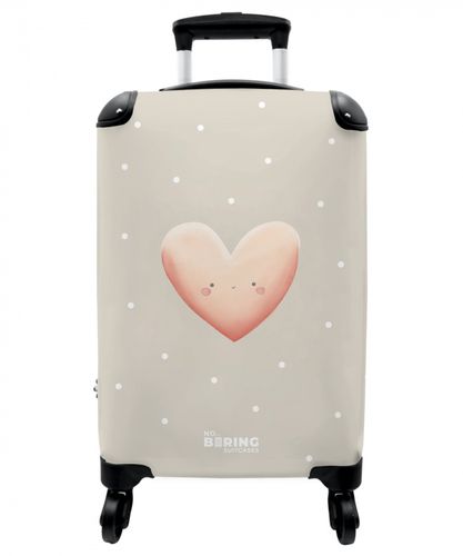 Pink heart surrounded by beige dots