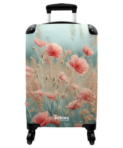 Field of flowers with pink poppies
